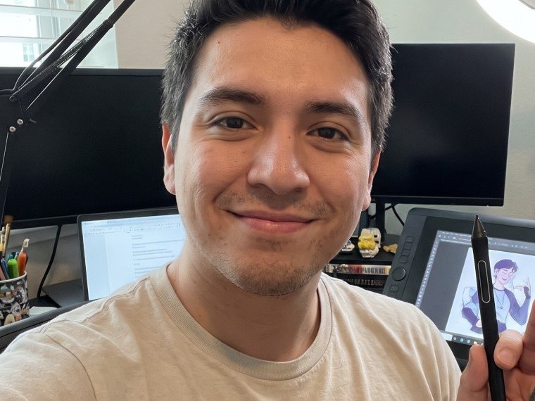 AI-generated image of a fictional artist at his desk, holding up a pen